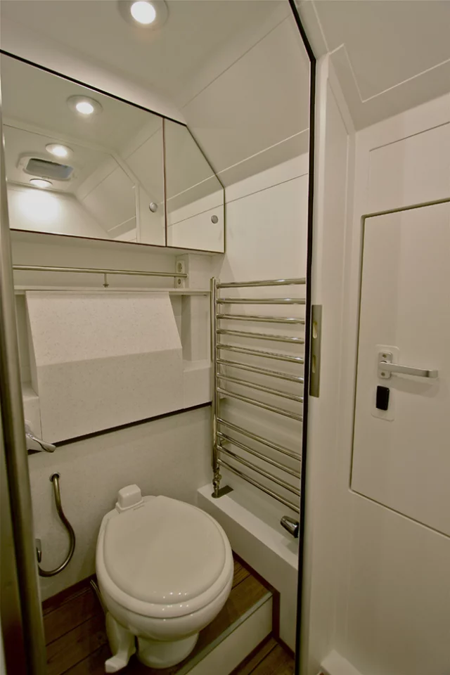 The fold-away sink makes strategic use of the small bathroom space