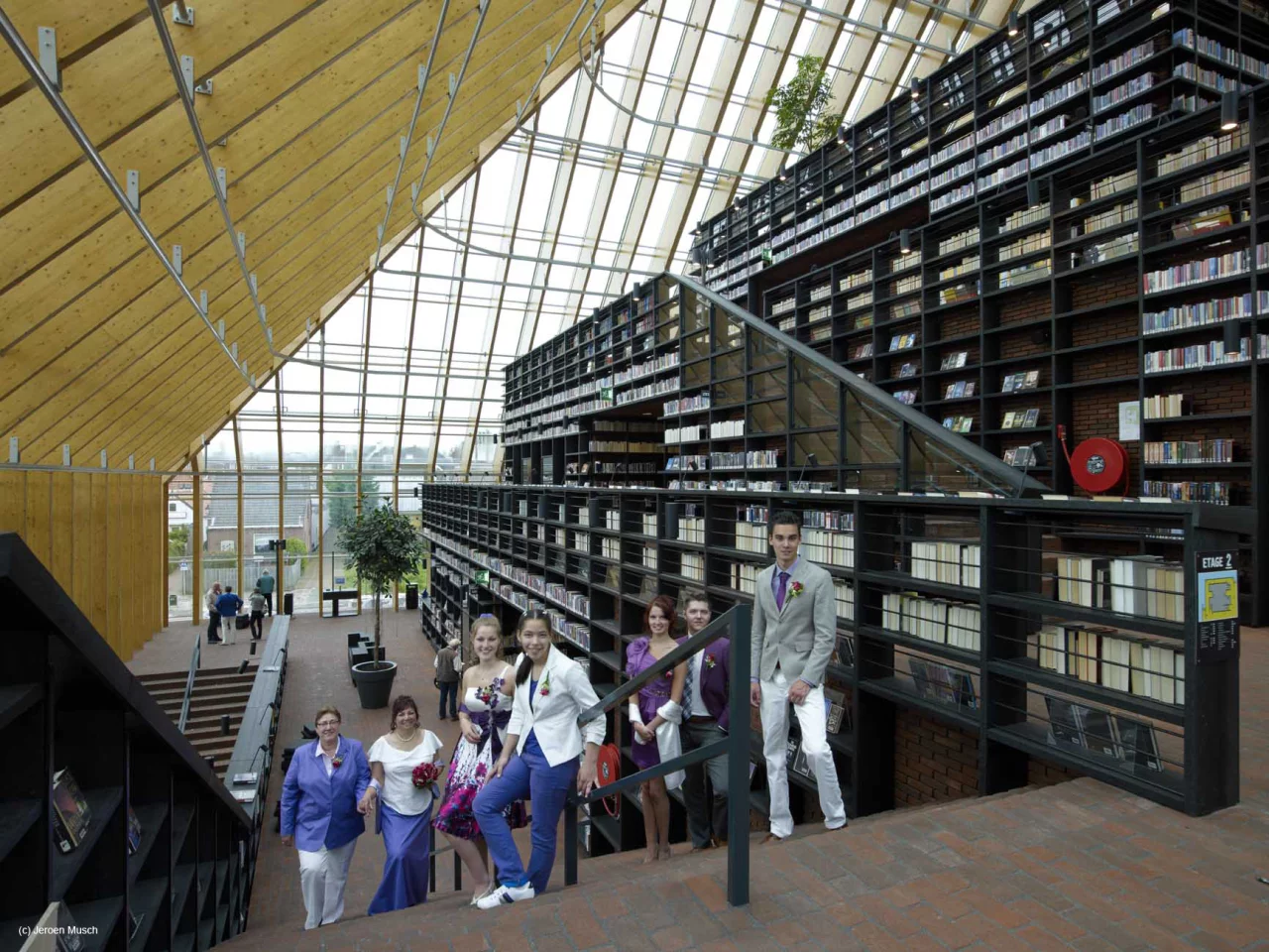 Visitors climb the wide stairway as they explore Book Mountain (Photo courtesy of MVRDV/Jeroen Musch)