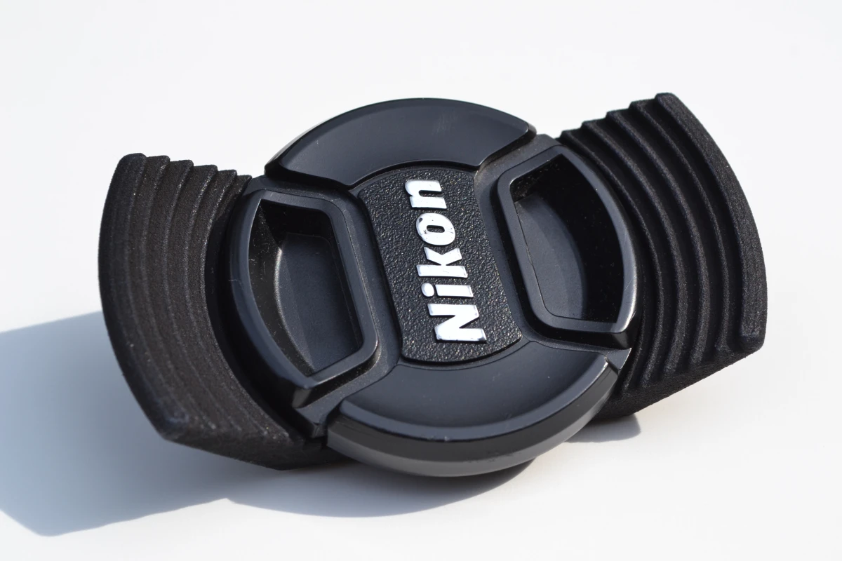 The Stow-Away lens cap holder attaches under your camera and gives you somewhere to stow your lens cap
