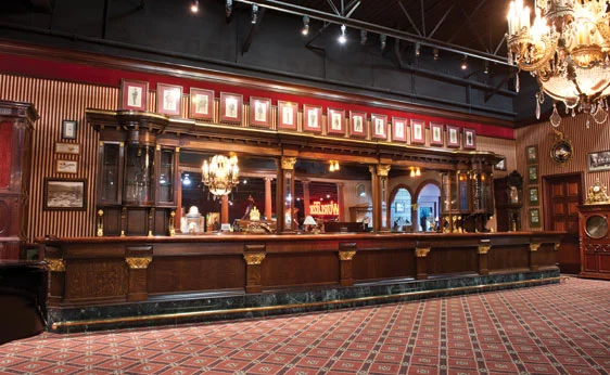 35 ft. Antique Front And Back Bar. Exceptional and rare, it features gilded wood, brass insets and marble. Expect to pay US$60,000-$90,000