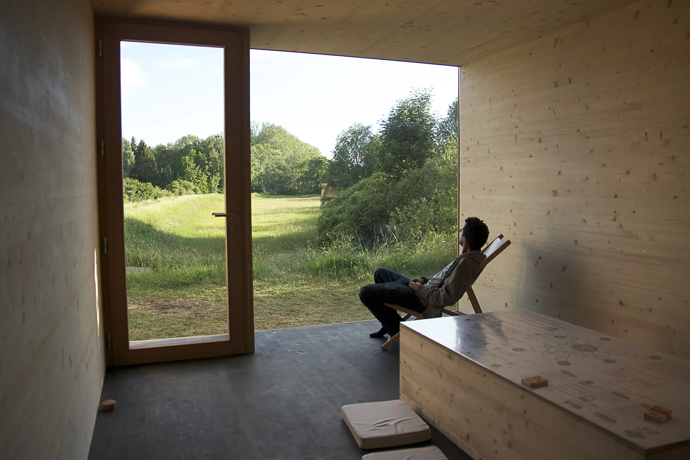 Inside the Nest, the space is simple and open, allowing for a quiet retreat with the barest of necessities