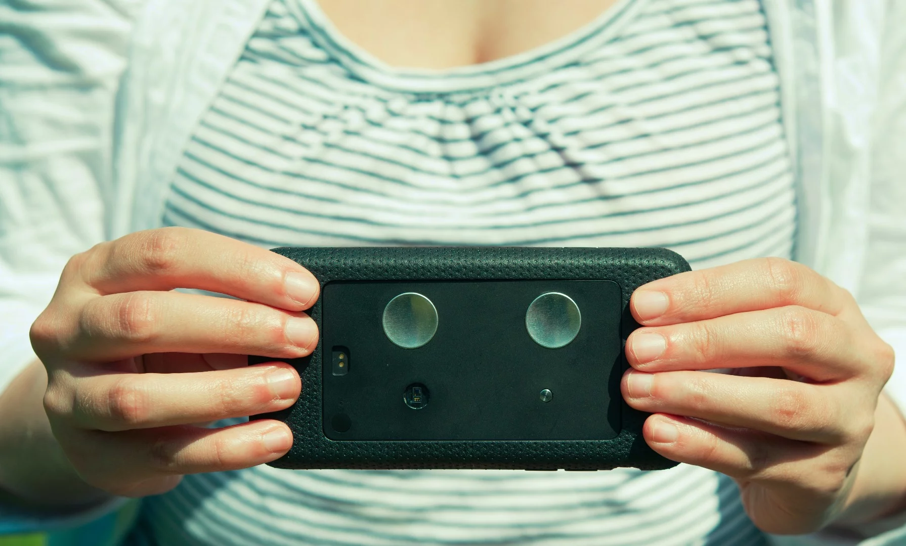 The Kito+ health tracker in one of the included iPhone cases