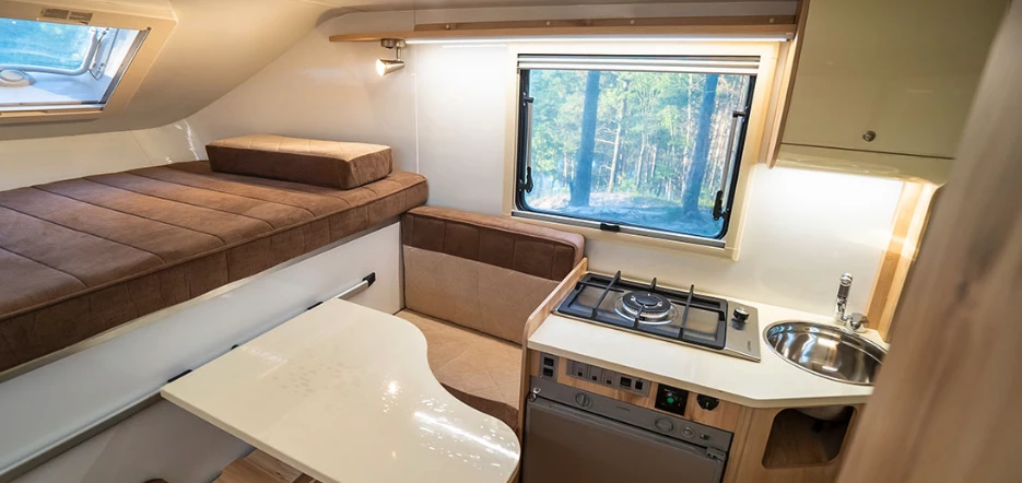 At night, the bed expands out over top the dinette