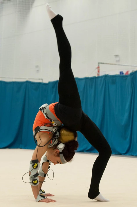 U.K. Olympic hopeful Mimi Cesar using the MotivePro vibrating suit that helps promote muscle memory
