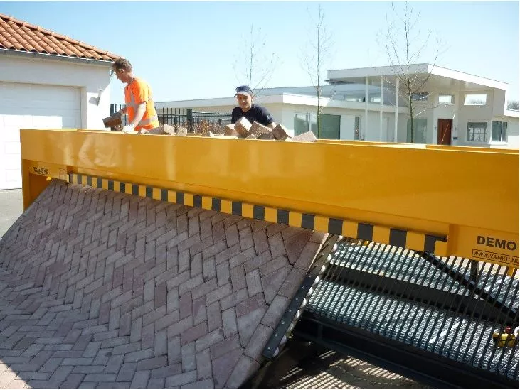The Tiger Stone laying a brick road