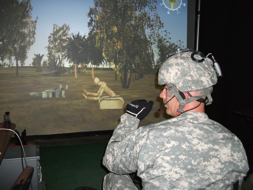 The iGlove enables a warfighter to easily command and control robotic devices through sensors and controllers built into a standard-issue glove (Image: TATRC)