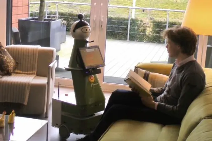 The Mobiserv robot communicates either by two-way audio, or via a touchscreen interface