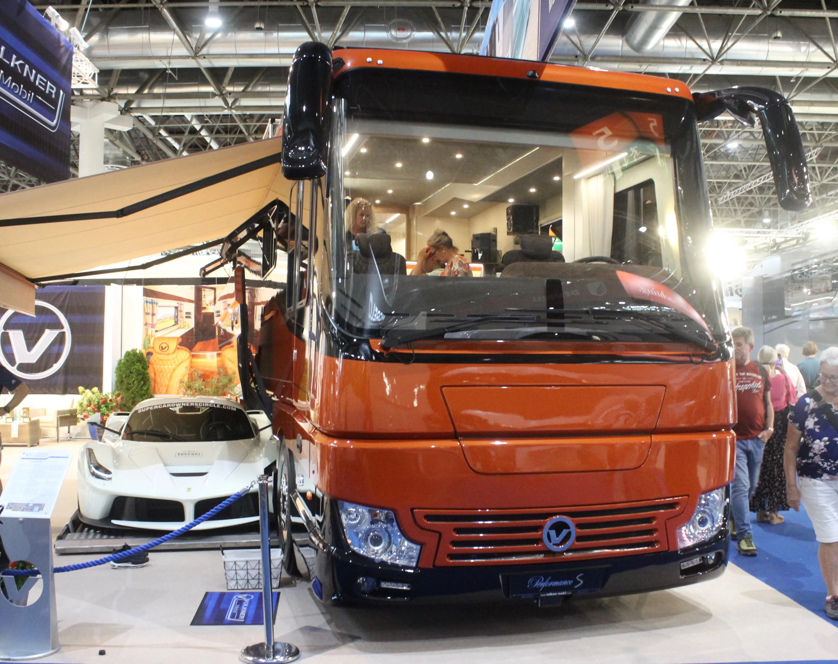 This particular Volkner Performance S combines an exterior sports car garage and roof deck with a unique custom interior