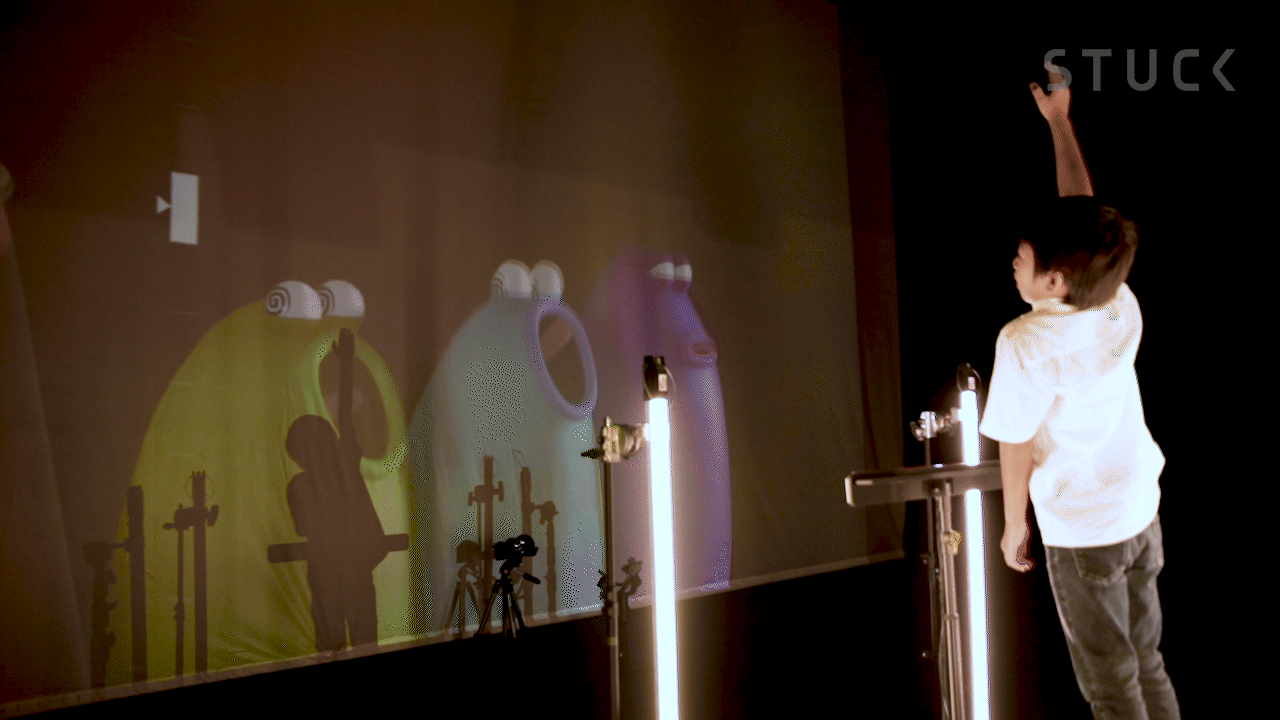 The gesture-tracking interface in front of this young conductor translates movements into controls for the Blob Opera