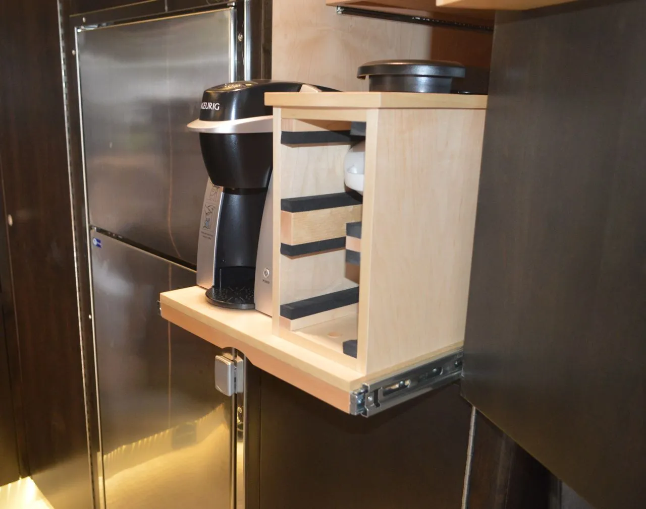 A slide-out Keurig makes for an easier cup of camp coffee