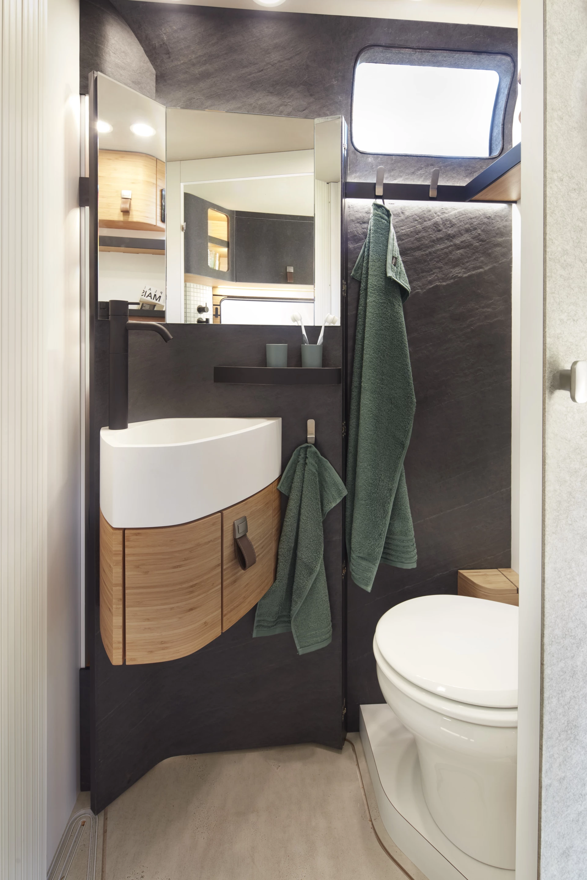 The bathroom transforms from a slim toilet room ...
