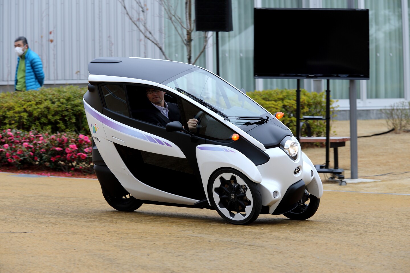 The Toyota i-Road in use at the Ha:mo (Harmonious Mobility) vehicle-sharing project in Japan