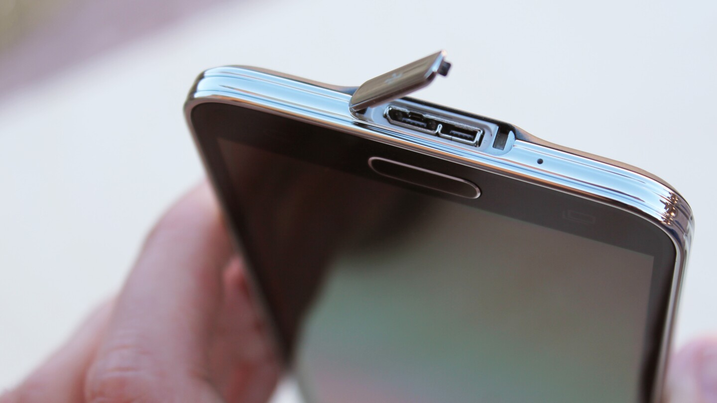 Like the Galaxy Note 3, the GS5 uses a micro USB 3.0 port for charging – and it's shielded by a flip-open cover