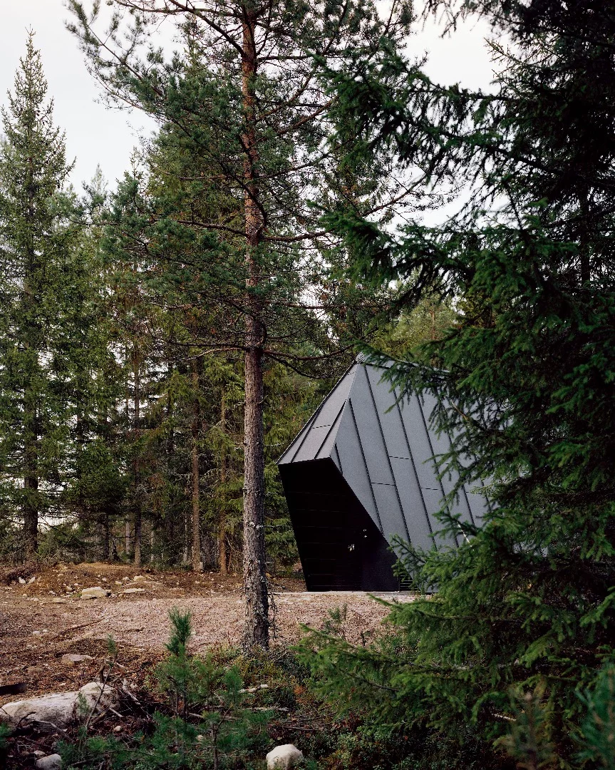 There's a small storage building in a similar style nearby