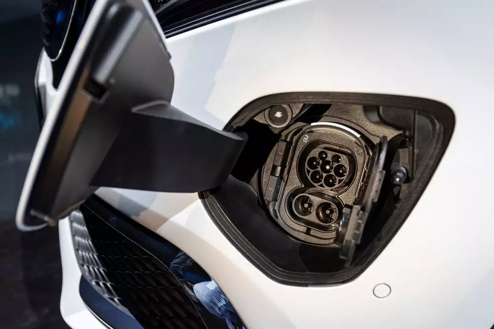 The charging port is integrated in the front-end, as part of the front-mounted electric drive