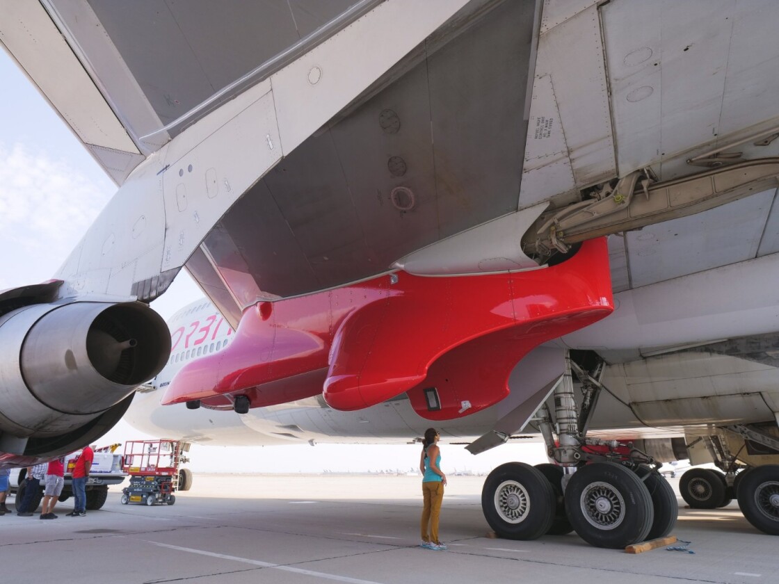 The pylon that will carry rockets aboard Virgin Orbit's Cosmic Girl mothership, seen in red