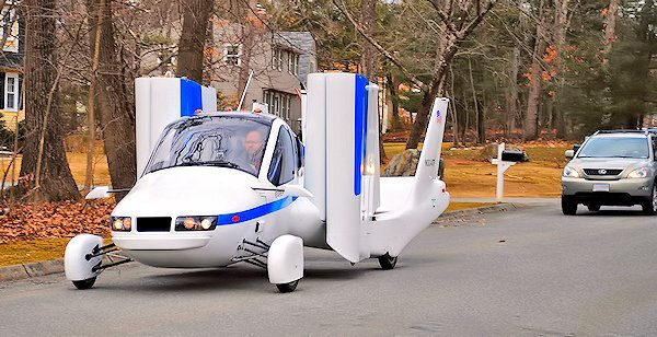 The Terrafugia Transition, wings folded, drives casually down a suburban street (Photo: Terrafugia)