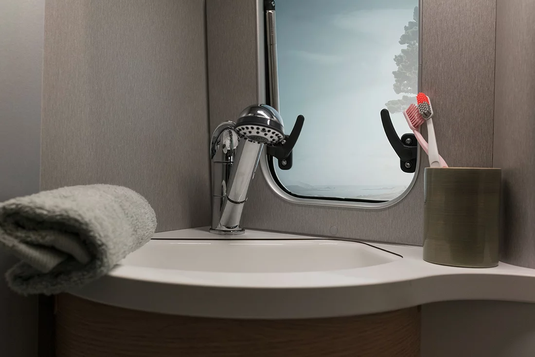 The bathroom faucet doubles as an indoor/outdoor shower