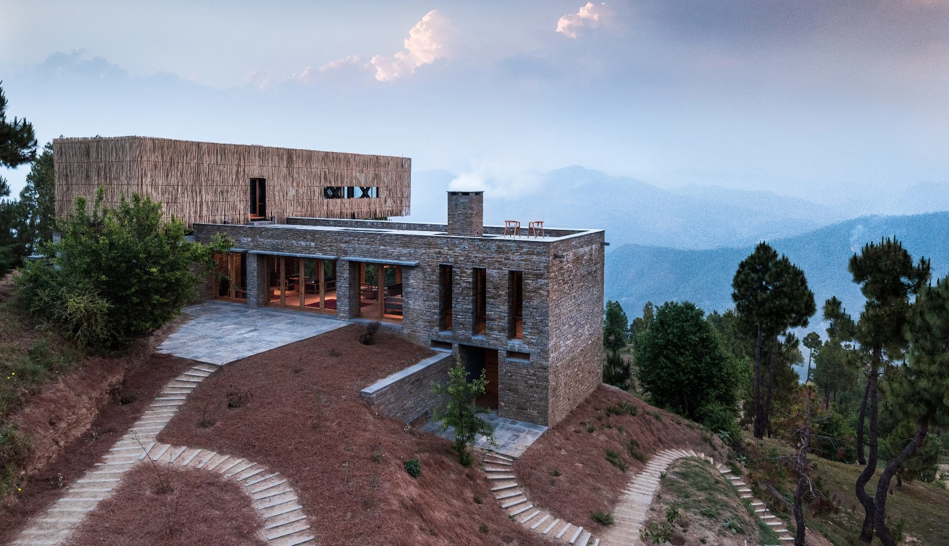 The Kumaon Hotel features a cantilevered dining room that juts out over the valley below