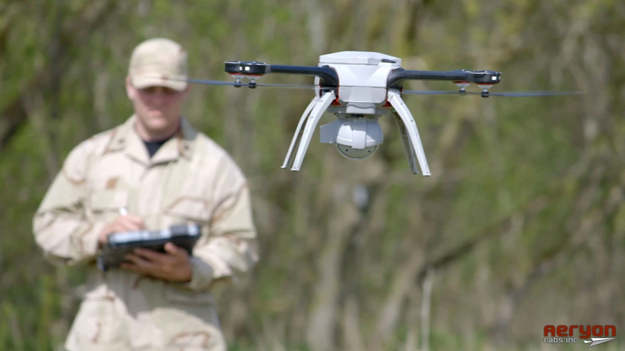 A lone operator pilots the SkyRanger with a tablet-like Ground Control Station (GCS) using simple touch controls to program a flight path or aim an onboard camera