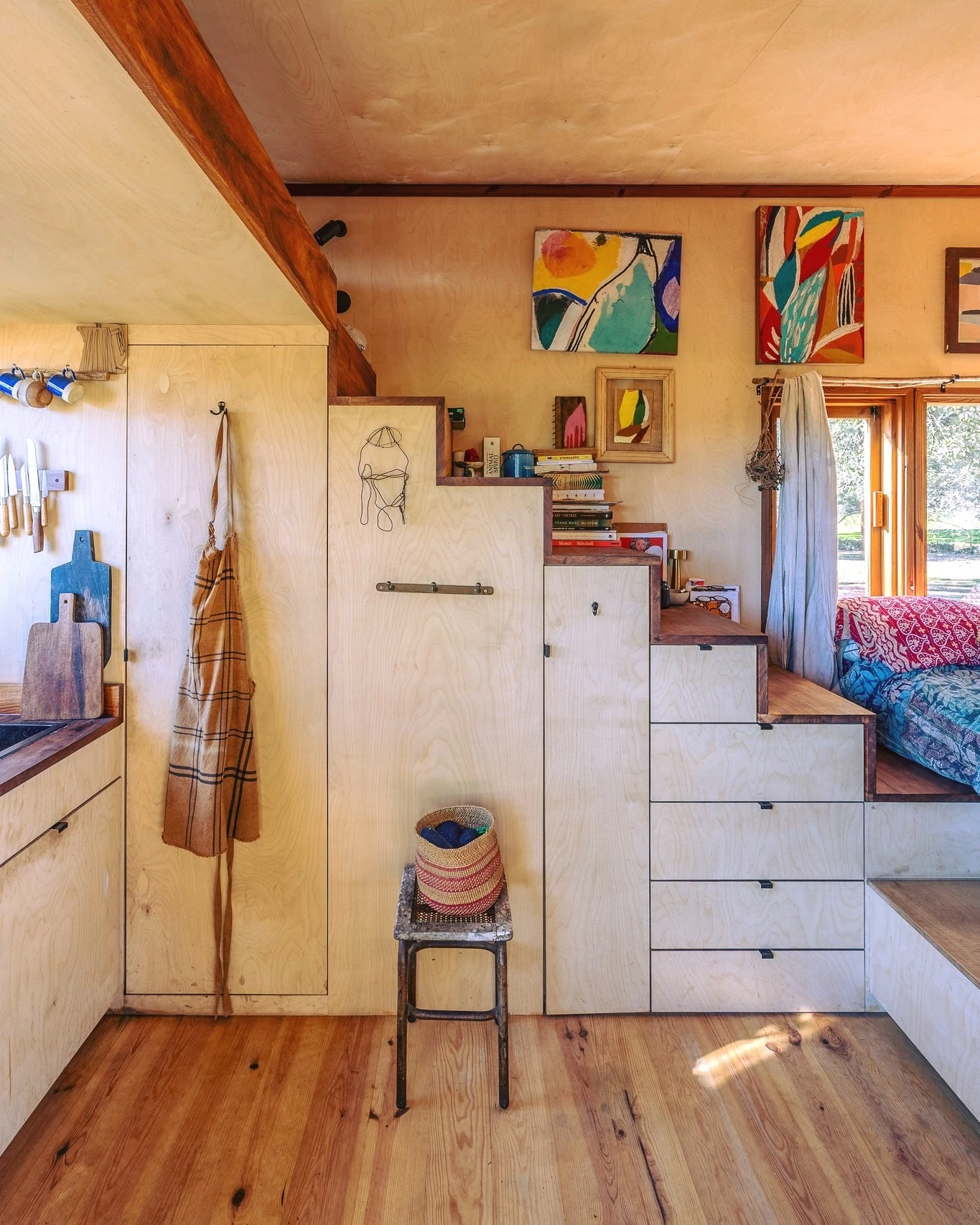 The Brava's upstairs bedroom is reached by storage-integrated staircase