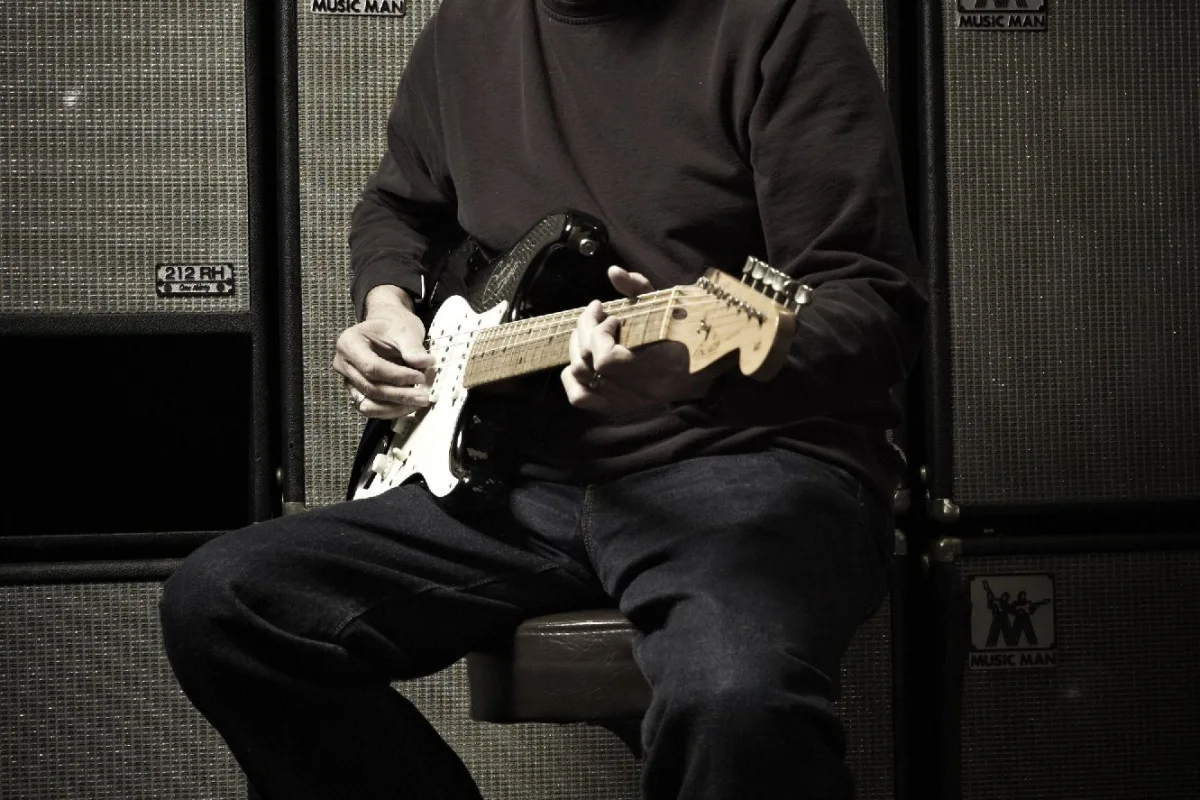 Eric Clapton with a signed 2006 'Blackie' recreation Stratocaster, estimated at between US$20,000 and US$30,000 (Credit: Original photo by Jack English, Marshbrook Limited 2010)