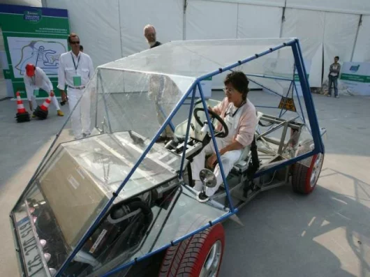 Madam Coqueline Courrèges behind the wheel of the EXE