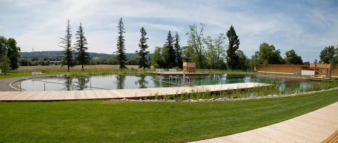 Features include a wading pool for toddlers, a separate pool with a sloping gravel beach, a water-slide, a 25-meter lap pool and a diving board (Photo: Helen Schneider)