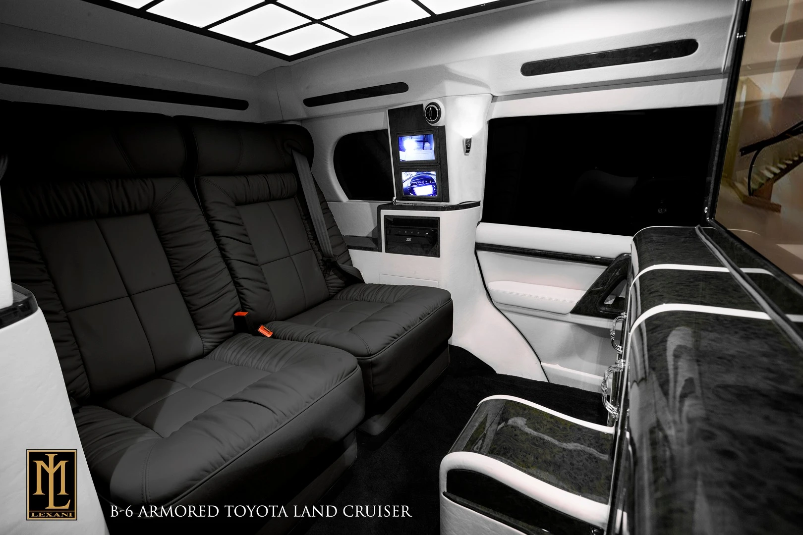 The vehicle's headliner and side walls are finished in Ultrasuede, with high quality carpeting and custom floor mats completing the aesthetic