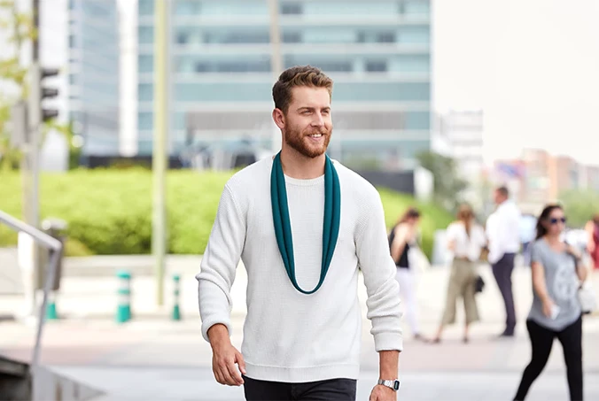 The Ostrich Pillow Loop can be worn as a scarf when not in use