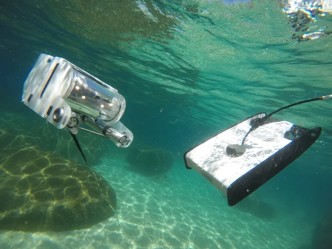 OpenROV's original ROV (left) and the Trident (right)