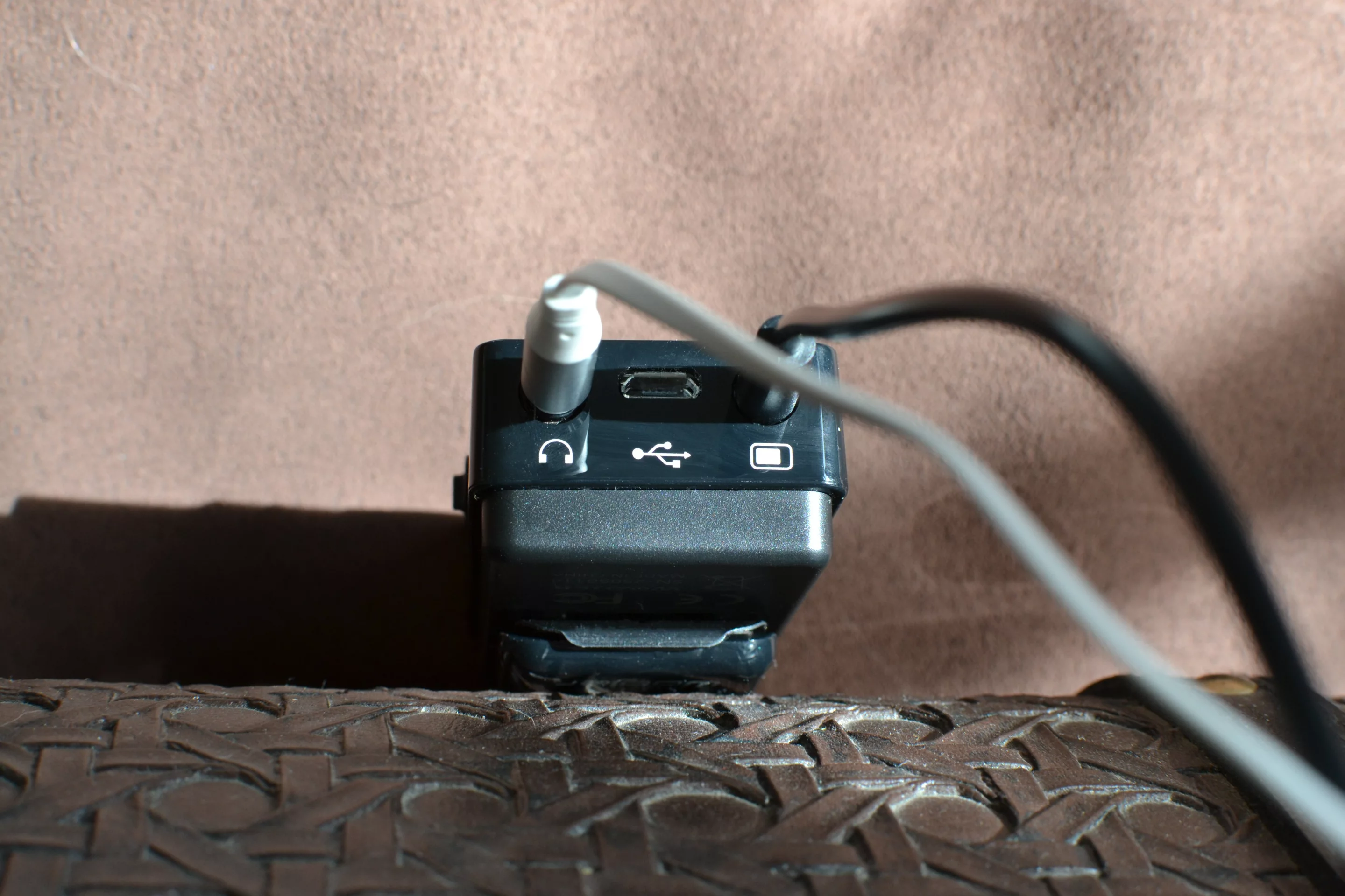 The bottom of the Woojer is home to a headphone jack, a USB charging port and an audio input jack (Photo: Paul Ridden/Gizmag)