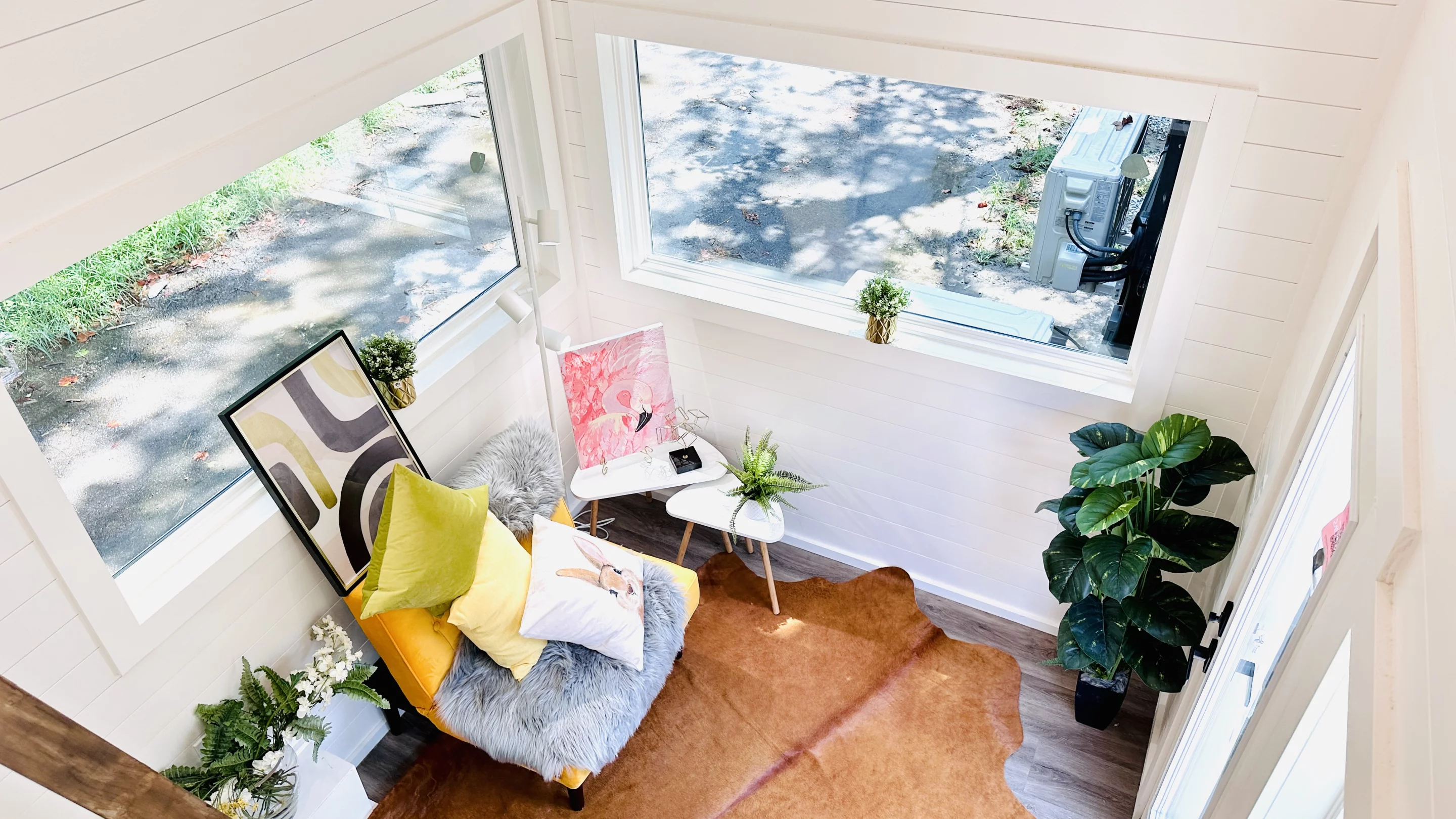 The 16' THOW With Loft's interior is light-filled thanks to its generous glazing