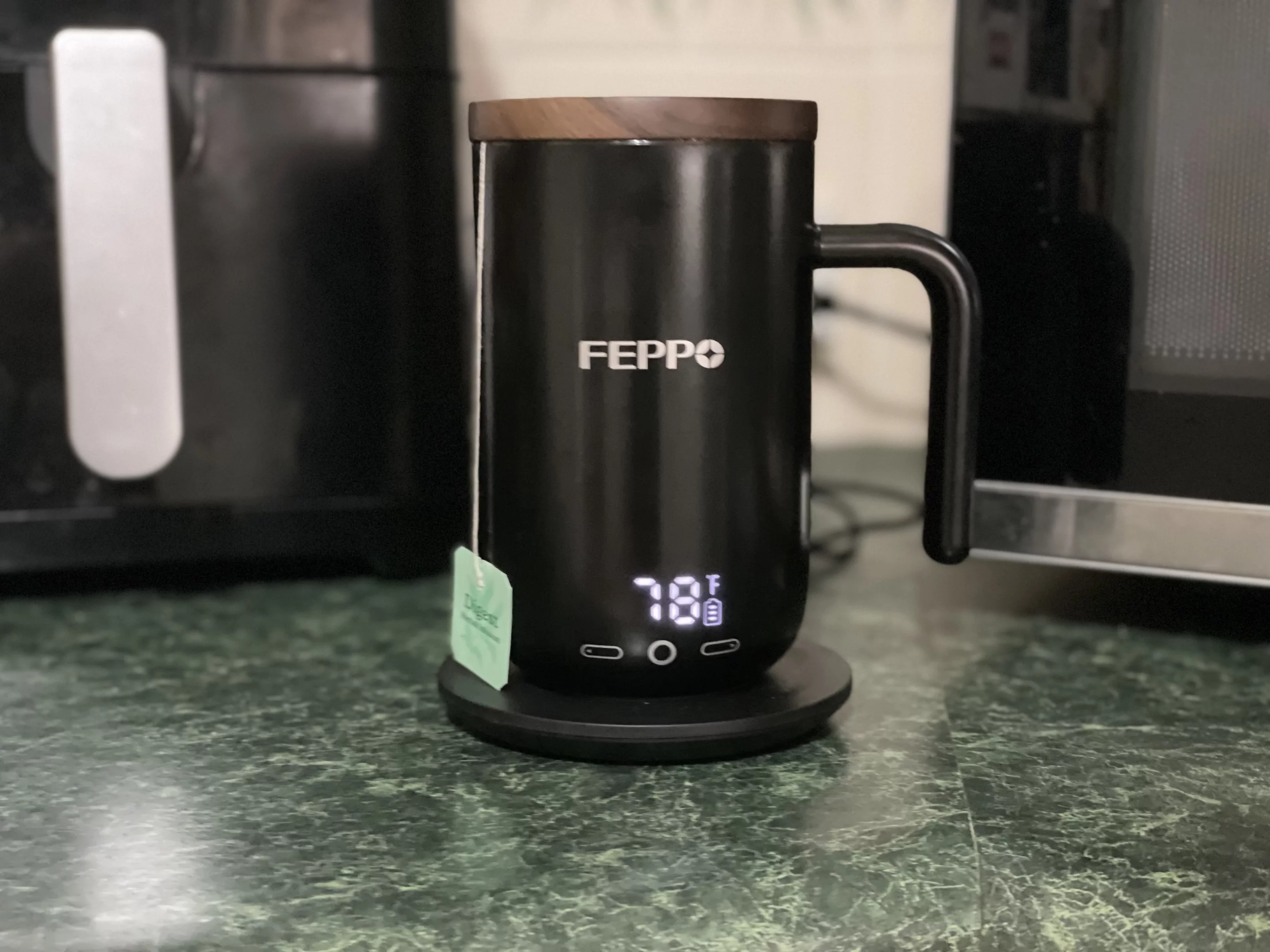 My tepid tea was placed back on the coaster for it to warm up again