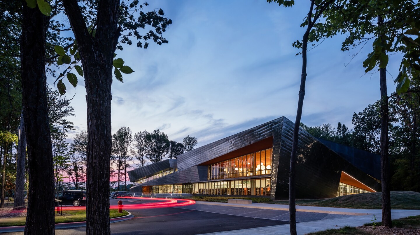 The Louisville Free Public Library South Central Regional Library is situated within a forest