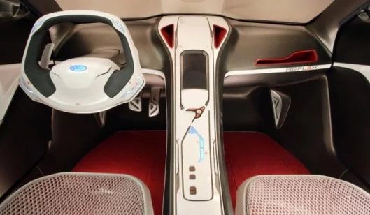 Shift paddles that control the 6-speed semiautomatic transmission are tucked behind the steering wheel, while the touch-screen center console helps reduce driver distraction.