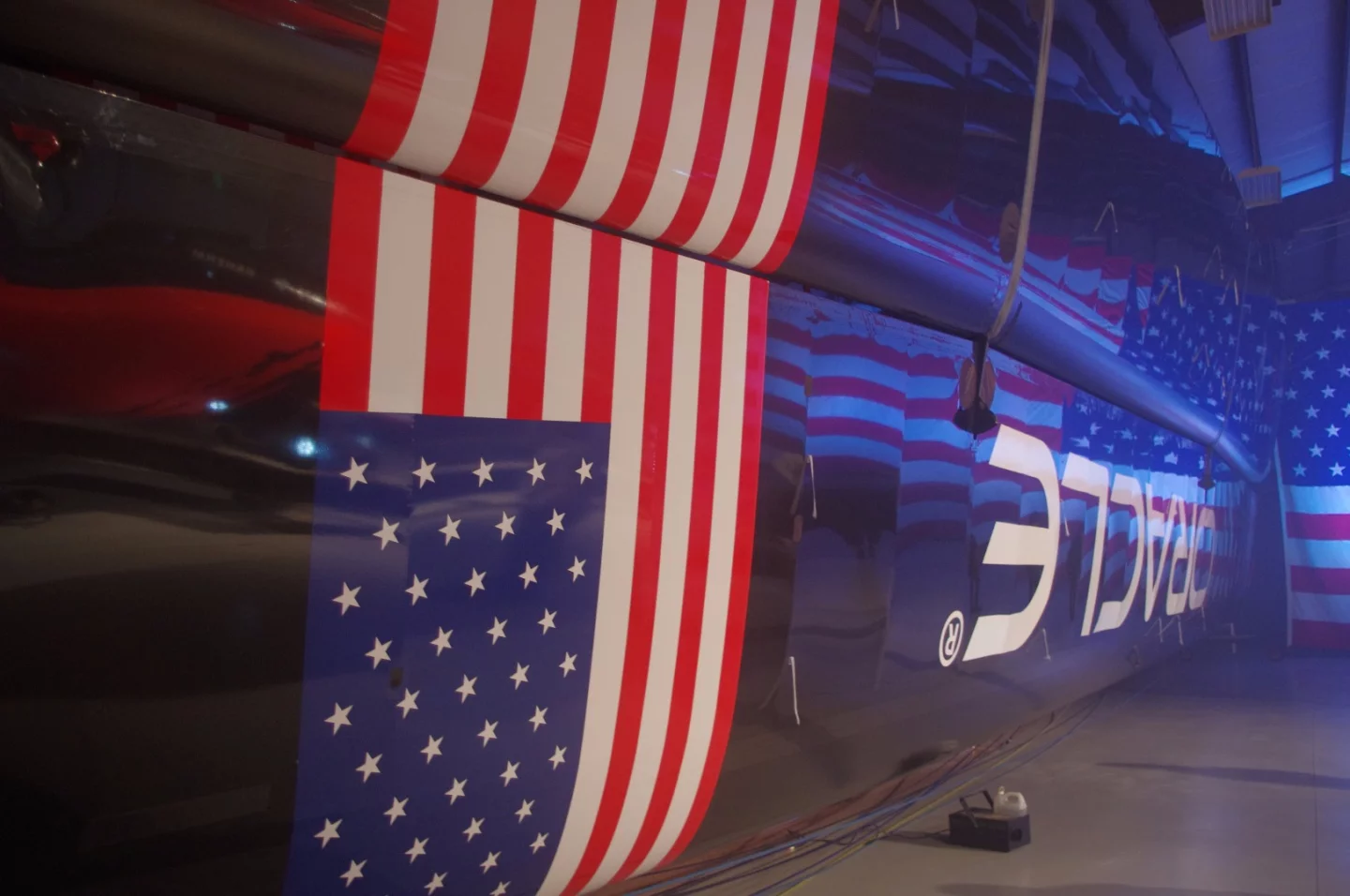 The yacht's sail (known as a wing) stored on its side in the warehouse. It resembles the wing of the Airbus A320.