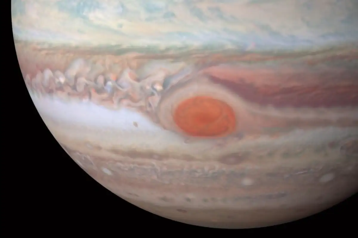 Juno is set to swoop low over Jupiter's Great Red Spot, a massive storm that's been raging for centuries, to probe its mysteries