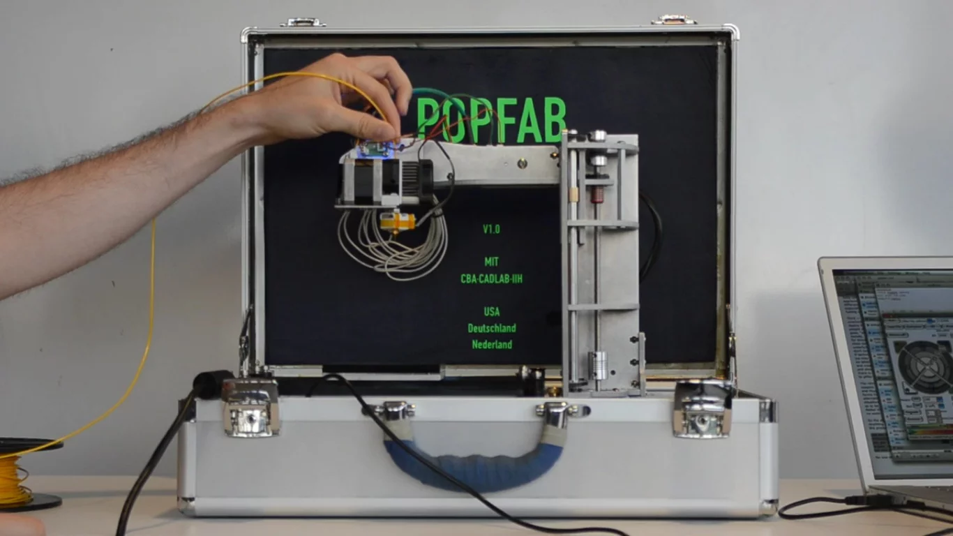 Two MIT students recently developed the PopFab, a machine that does 3D printing, milling, vinyl cutting, and drawing, all while fitting inside a small suitcase