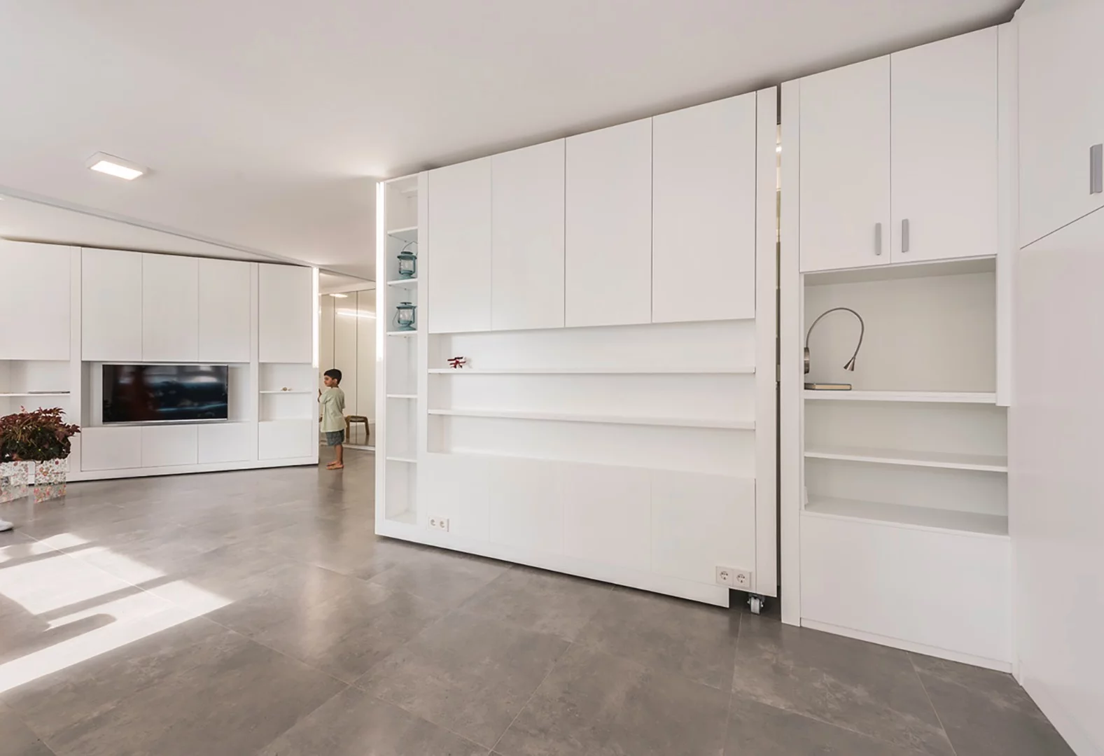 Thanks to its clever movable walls and folding furniture, the home can serve as an apartment with two bedrooms, one bedroom, or no bedrooms at all