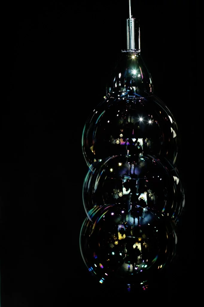 Instead of a lampshade, the Surface Tension Lamp continuously blows bubbles