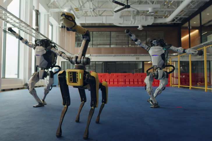 Two Atlas robots and a Spot