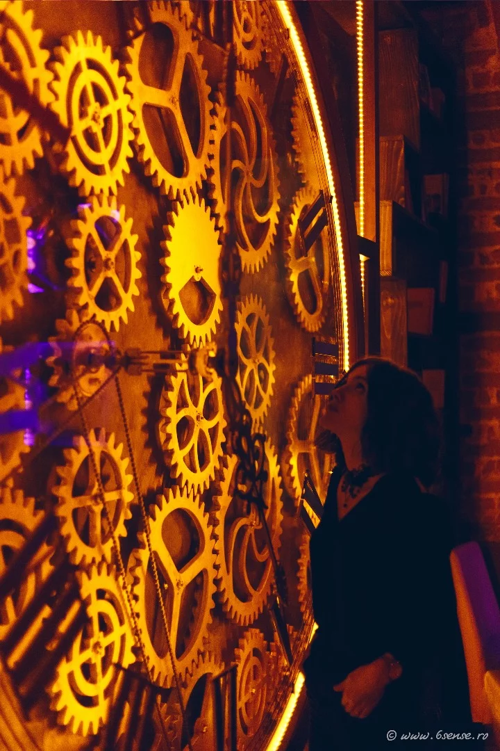 The back wall is dominated by a clock