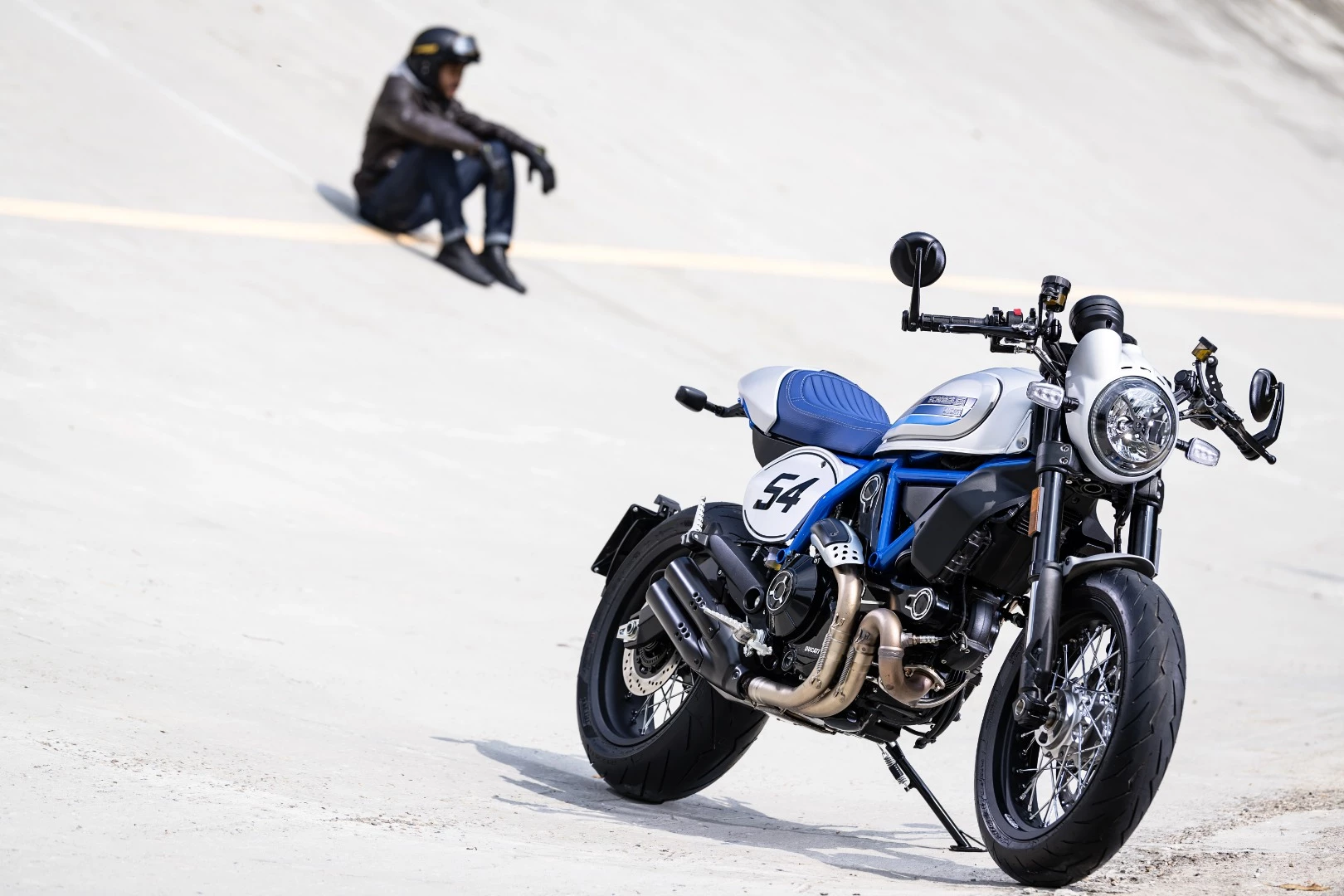 The Scrambler Café Racer references "the bikes that roared down British streets in the '60s"