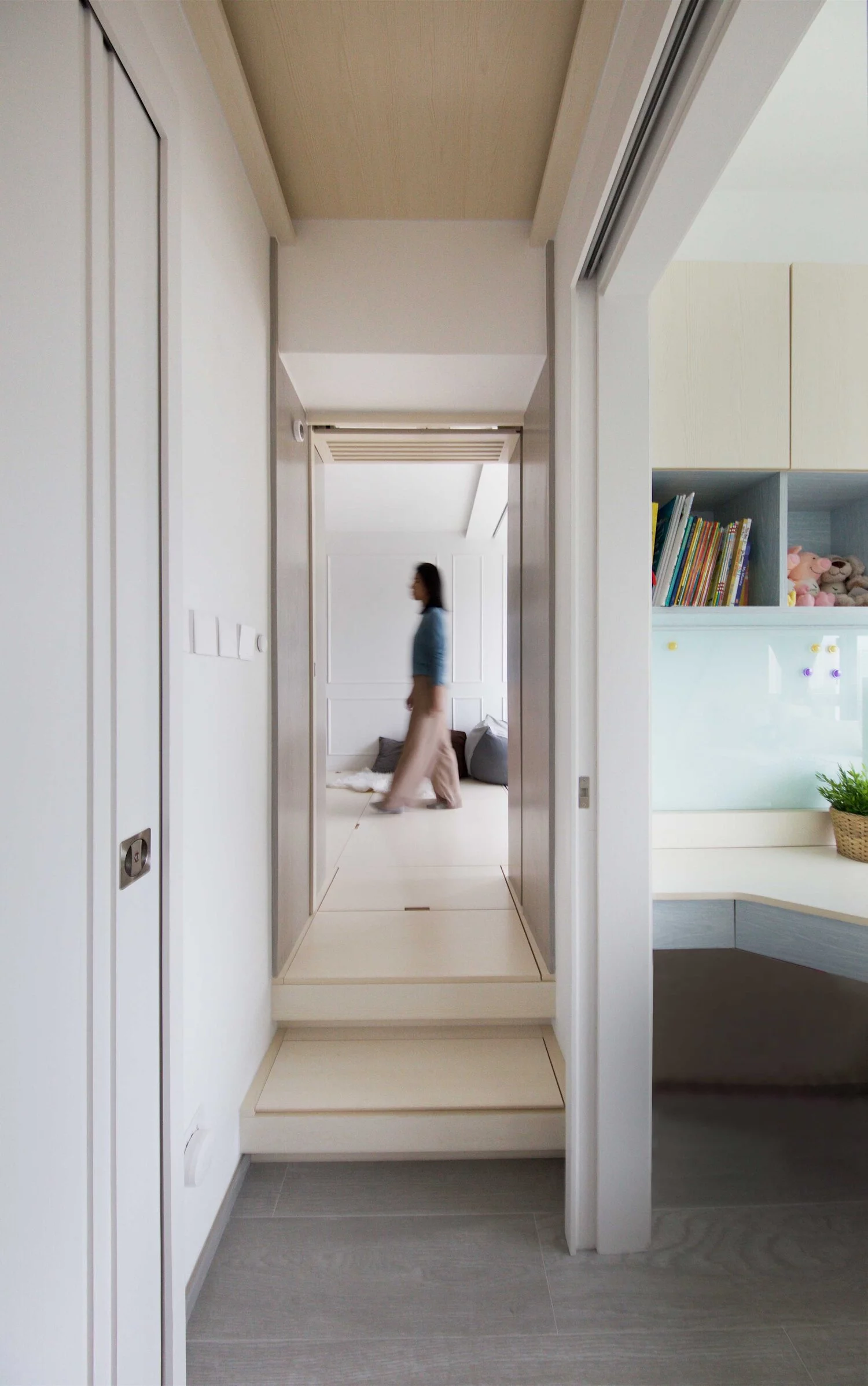 Two steps and a walkway leads to the living area