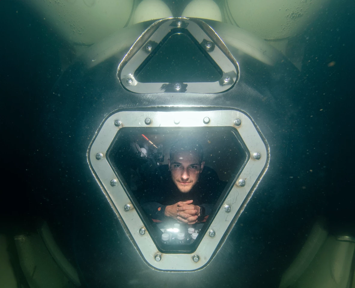 Sebastian Aristotelis peers out the window of the UHAB demonstrator
