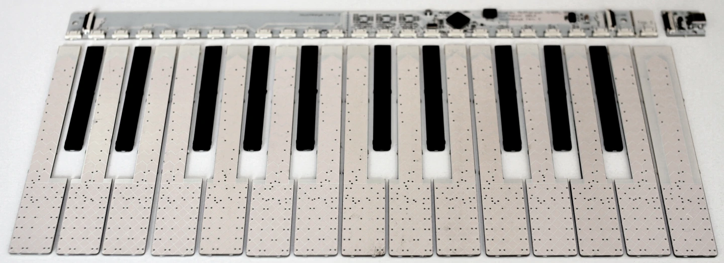 The TouchKeys black and white sensor strips and controller board