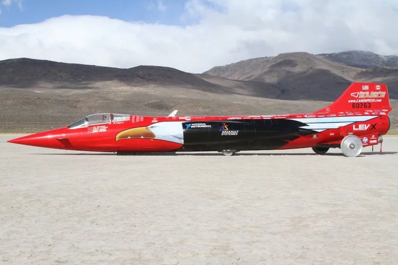 The NAE delivered a top speed of 371 mph (597 km/h) on the first run, and 440.7 mph (709.25 km/h) on the second, producing a record breaking average speed of 392.954 mph (632.39 km/h)