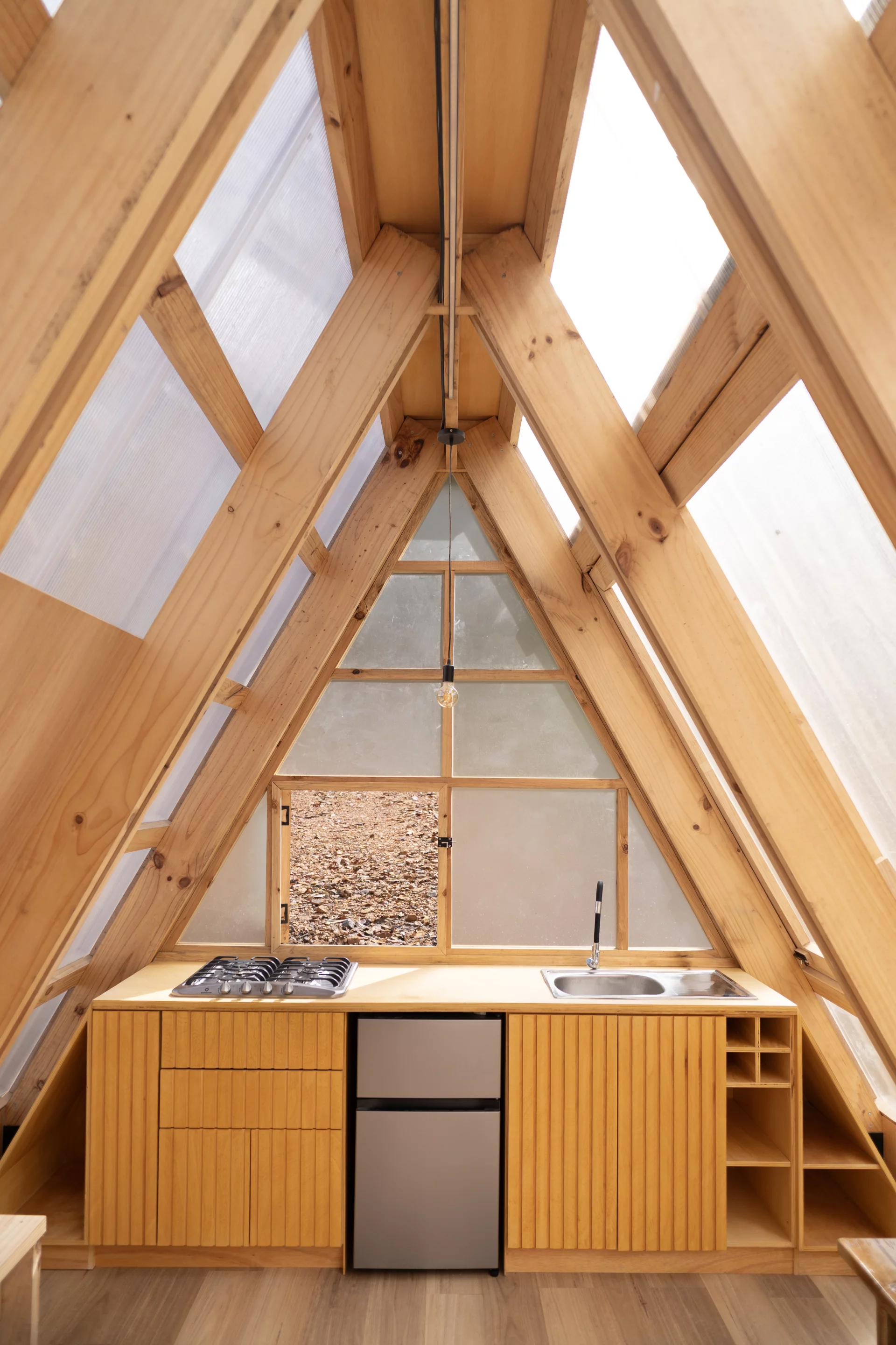 Casa 6-3 features a compact timber kitchen