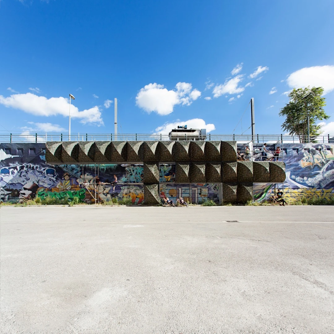 This installation, called Stealth Shelters, sits between public and private property suggesting an in-between liminal space where those without a home to go to could find a safe place at night